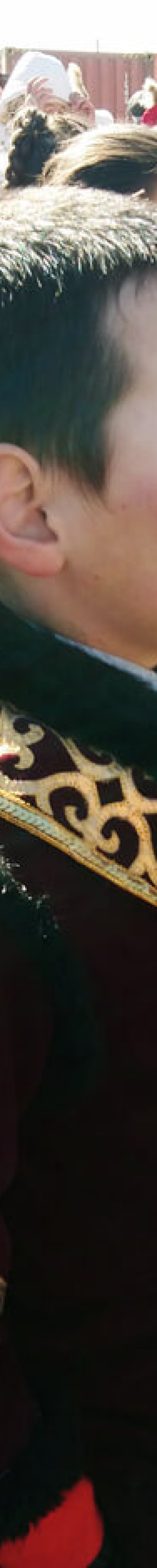 Kids in traditional clothes at Golden Eagle festival site