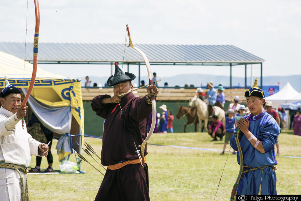 Archer is shooting at Naadam Festival naadam festival Mongolia