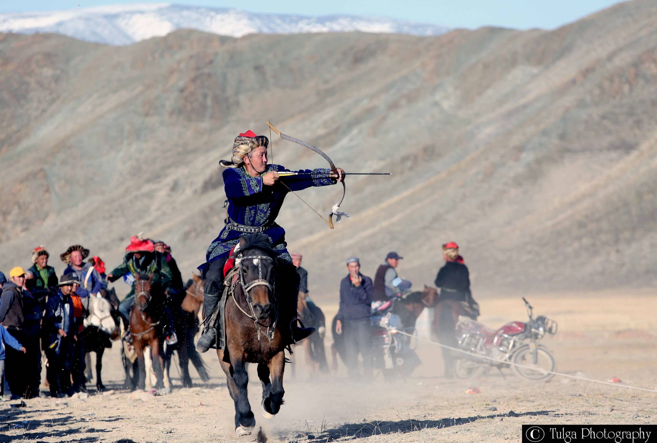 Horseback archery in Altai Eagle Festival Mongolia