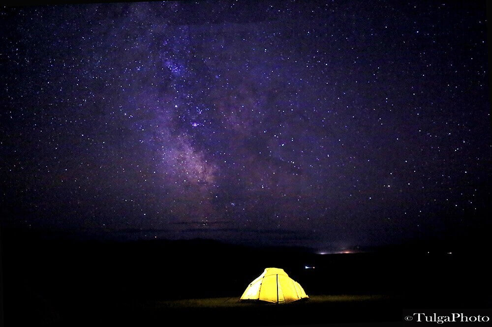 Tented camping with starry night sky