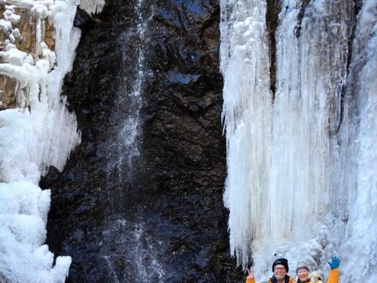 Yolyn am clients posing before the frozen stream