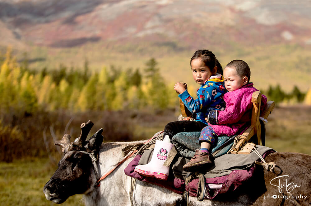 young reindeer riders boy and girl Top 5 Photography Tours Mongolia