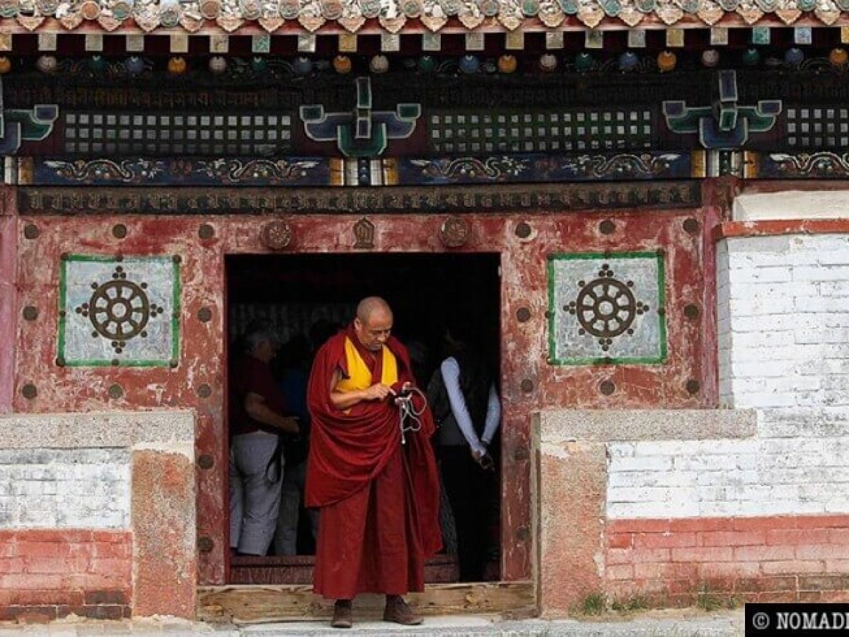 lama leaving chanting temple at Gandan monastery complex - Ulaanbaatar city tour